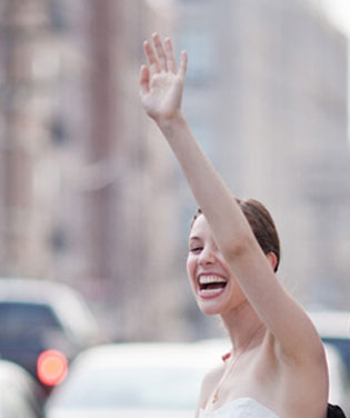 Woman hailing a taxi